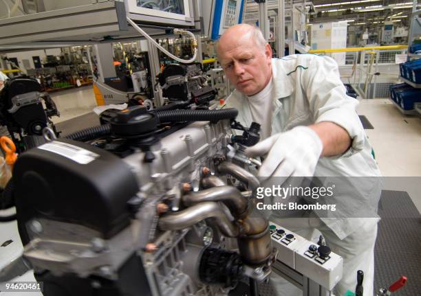 Workers assemble engines at the Skoda plant in Mlada Boleslav, Czech Republic, Thursday, October 19, 2006.
