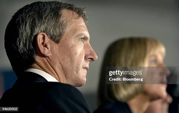 Russell Chenu, executive vice president and chief financial officer, left, looks across at Meredith Hellicar, chairwoman, as they speak to reporters...