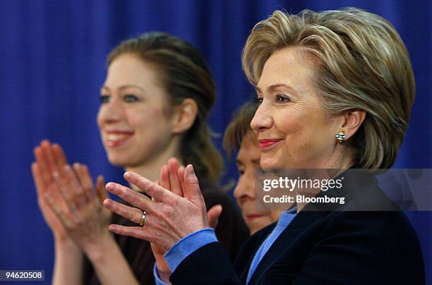 Hillary Clinton, right, U.S. Senator from New York and Democratic presidential candidate, applauds along with her mother Dorothy Rodham, center, and...