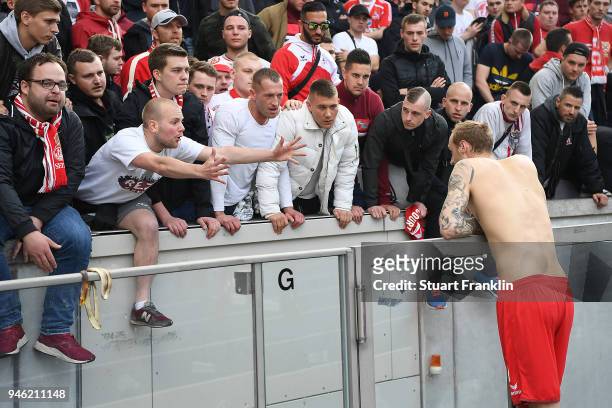 Supporters of Koelen show their feelings about their team while Marcel Risse of Koeln talks to them, after the Bundesliga match between Hertha BSC...
