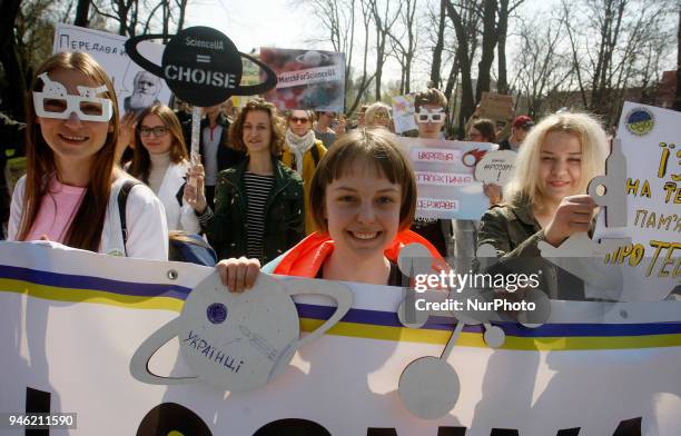 People carry placards reading like &quot;Who you gonna call?&quot;, &quot;We do,what we must,because we can&quot;,&quot;Science is...