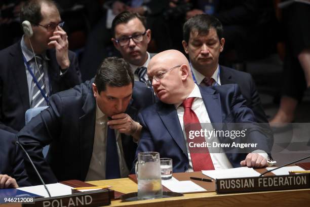 Deputy Russian Ambassador to the United Nations Vladimir Safronkov talks with Russian Ambassador to the United Nations Vasily Nebenzya during a...