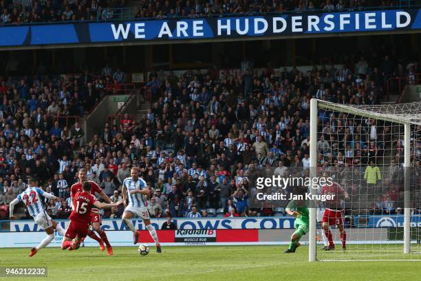 Tom Ince of Huddersfield Town scores his sides first goal during the Premier League match between Huddersfield Town and Watford at John Smith's...