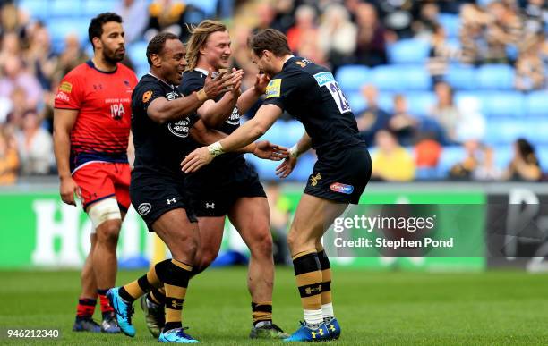 Josh Bassett of Wasps celebrates scoring a try during the Aviva Premiership match between Wasps and Worcester Warriors at The Ricoh Arena on April...