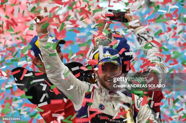 Winner DS Virgin racing team driver Sam Bird of Britain celebrates on the podium after the Rome leg of the Formula E electric car championship in the...