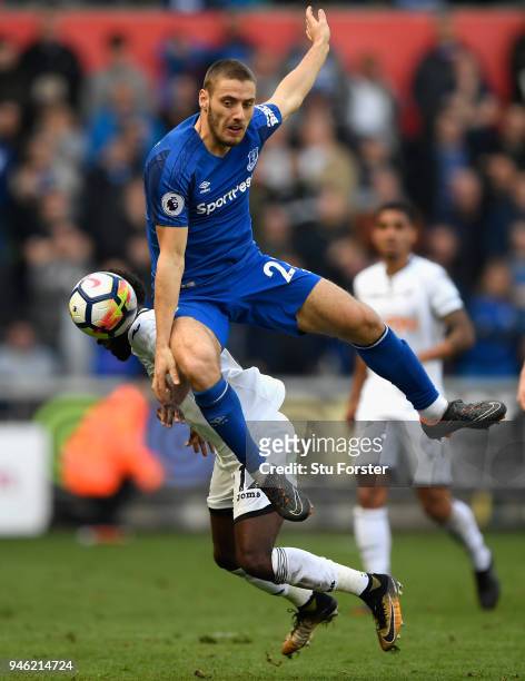 Swansea player Nathan Dyer is challenged by Nikola Vlasic of Everton during the Premier League match between Swansea City and Everton at Liberty...