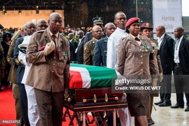 Members of the South African military carry the coffin of anti-Apartheid icon Winnie Madikizela Mandela during her funeral at the Orlando Stadium, in...