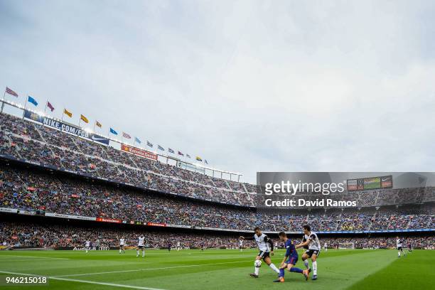 Denis Suarez of FC Barcelona competes for the ball with Jeison Murillo and Dani Parejo of Valencia CF during the La Liga match between Barcelona and...