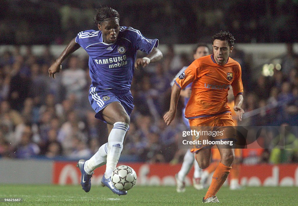 Chelsea forward Didier Drogba on the ball while being chased