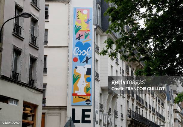 Picture taken on April 14, 2018 shows a mural by US artist Nina Chanel Abney set up front of the Citizen Hotel in Paris as the first of a series of...