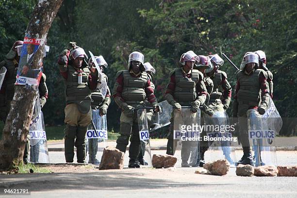 Police officers in riot gear block a major road in the center of Nairobi, Kenya on Monday, Dec. 31, 2007. Kenyan police maintained a ban on live...