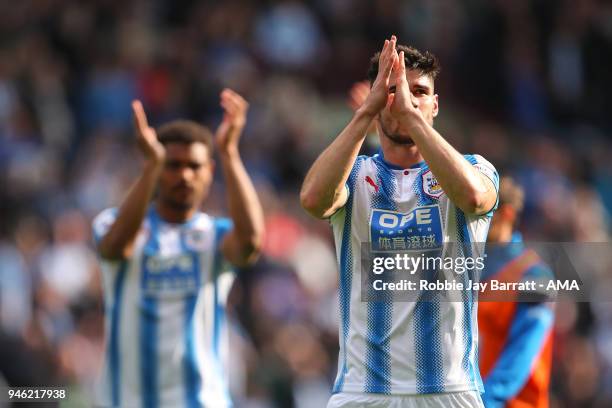 Christopher Schindler of Huddersfield Town applauds the fans at full time during the Premier League match between Huddersfield Town and Watford at...