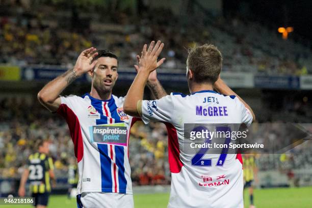 Newcastle Jets defender Jason Hoffman congratulates team mate Riley McGree on his third goal at the A-League Soccer Match between Central Coast...
