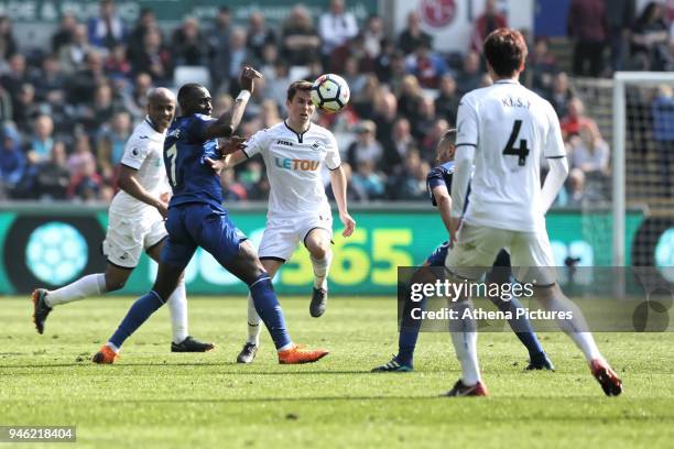 Tom Carroll of Swansea City controls the ball next to Yannick Bolasie of Everton during the Premier League match between Swansea City and Everton at...