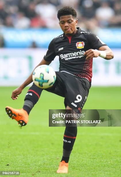Leverkusen's Jamaican midfielder Leon Bailey controls the ball during the German first division Bundesliga football match Bayer 04 Leverkusen vs...