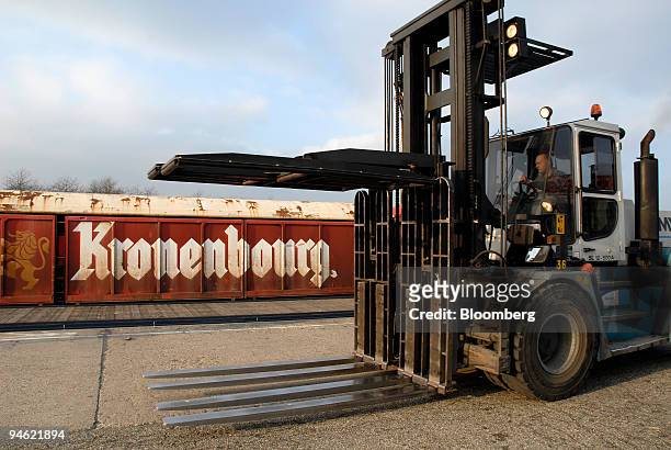 Worker drives a forklift used to transport crates of Kronenbourg beer at the company's brewery in Obernay, France, on Tuesday, Dec. 18, 2007....