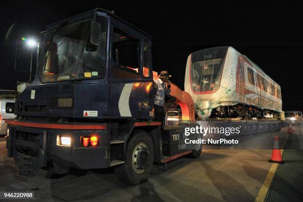 Train set of Light Rail Transit pulls out from the cargo ship upon arrival at Tanjung Priok Car Terminal in Jakarta, Indonesia on April 14, 2018. One...
