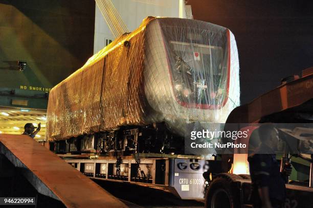 Train set of Light Rail Transit pulls out from the cargo ship upon arrival at Tanjung Priok Car Terminal in Jakarta, Indonesia on April 14, 2018. One...