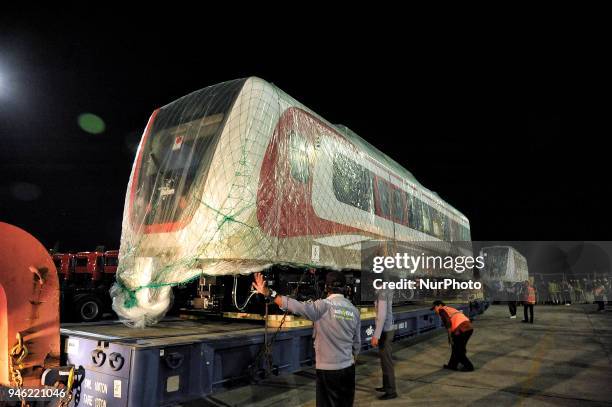 Train set of Light Rail Transit pulls out from the cargo ship upon arrival at Tanjung Priok Car Terminal in Jakarta, Indonesia on April 14, 2018. One...