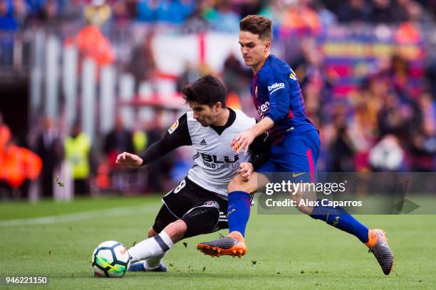 Denis Suarez of FC Barcelona fights for the ball with Carlos Soler of Valencia CF during the La Liga match between Barcelona and Valencia at Camp Nou...