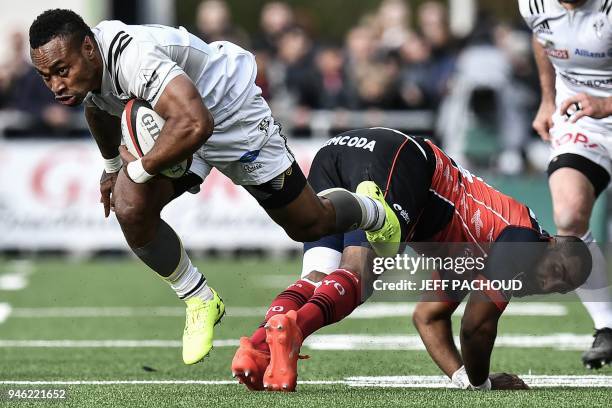 Brive's Fijian wing Benito Masilevu vies with Oyonnax's French wing Daniel Ikpefan during the French Top 14 rugby union match US Oyonnax vs CA Brive,...