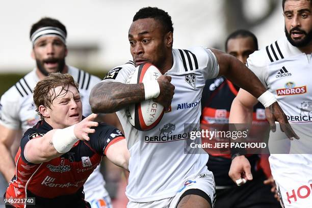 Brive's Fijian wing Benito Masilevu vies with Oyonnax' South-African scrum-half James Hall during the French Top 14 rugby union match US Oyonnax vs...