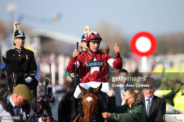 Davy Russell celebrates after riding Tiger Roll to victory during the 2018 Randox Health Grand National at Aintree Racecourse on April 14, 2018 in...