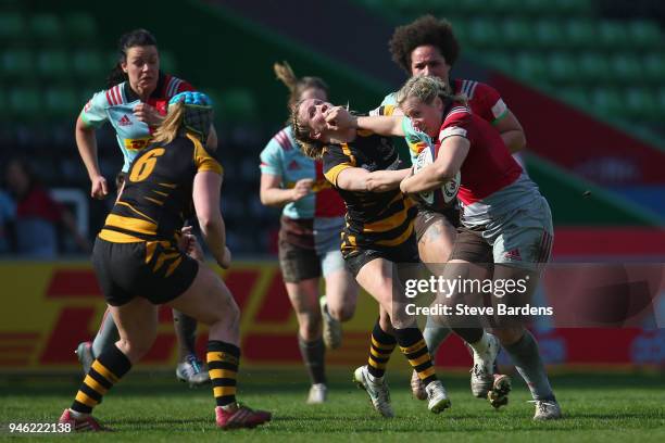 Vickii Cornborough of Harlequins Ladies hands off Danielle Waterman of Wasps FC Ladies defence during the Tyrrells Premier 15s Semi Final 2nd Leg...