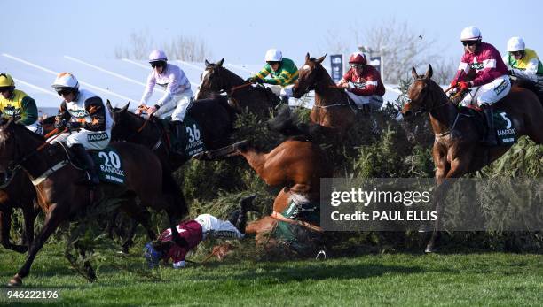 Alpha des Obeaux unseats jockey Rachael Blackmore at The Chair during the Grand National horse race on the final day of the Grand National Festival...
