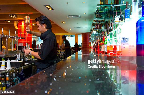 Bartender prepares a drink at "Apres," a cocktail lounge bar and restaurant at the Mall of the Emirates in Dubai, United Arab Emirates, Sunday, April...