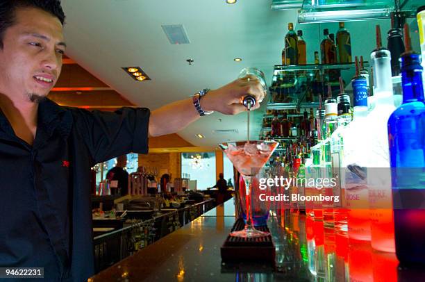 Bartender prepares a drink at "Apres," a cocktail lounge bar and restaurant at Ski Dubai at the Mall of the Emirates in Dubai, United Arab Emirates,...