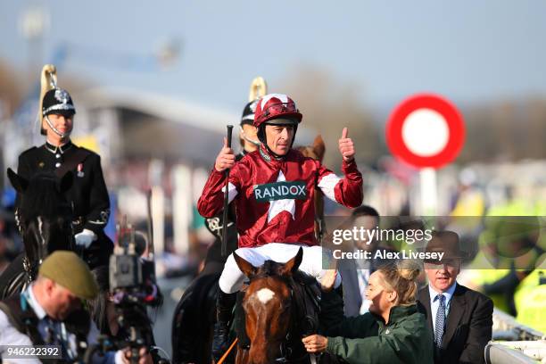 Davy Russell celebrates after riding Tiger Roll to victory during the 2018 Randox Health Grand National at Aintree Racecourse on April 14, 2018 in...