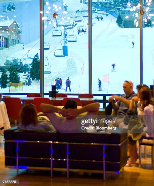 Guest in "Apres," a cocktail lounge bar and restaurant, watch skiers at Ski Dubai at the Mall of the Emirates in Dubai, United Arab Emirates, Sunday,...