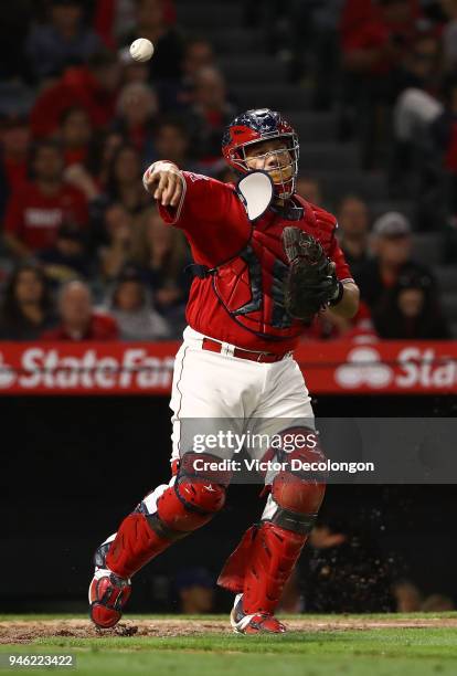 Catcher Rene Rivera of the Los Angeles Angels of Anaheim throws to first base in the eighth inning during the MLB game against the Oakland Athletics...