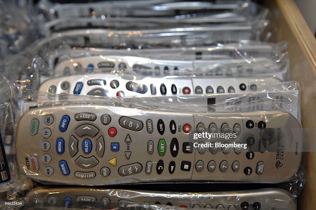 Remote controls await customers in a Time Warner Cable store... News ...