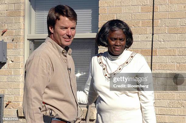 Former Senator John Edwards of North Carolina stands with homeowner Orelia Tyler, Wednesday, December 27, 2006 in in New Orleans, Louisiana. Edwards...