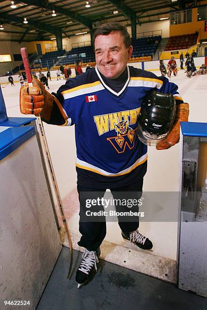 Canadian Finance Minister Jim Flaherty exits the ice rink after skating with kids and a news conference to promote the Children's Fitness Tax Credit...