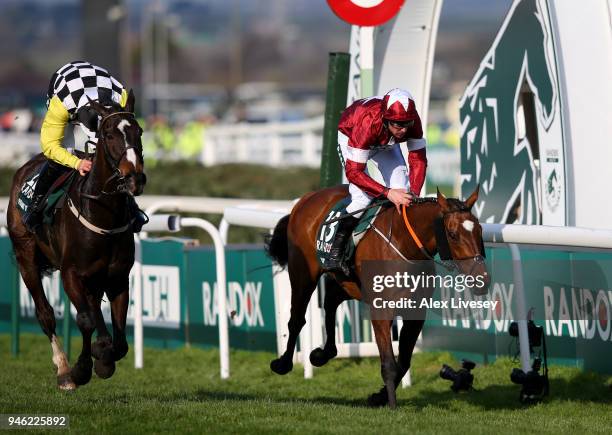 Davy Russell rides Tiger Roll to victory, closely followed by David Mullins riding Pleasant Company during the 2018 Randox Health Grand National at...