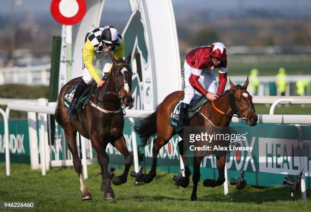 Davy Russell rides Tiger Roll to victory, closely followed by David Mullins riding Pleasant Company during the 2018 Randox Health Grand National at...