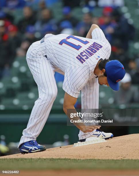 Starting pitcher Yu Darvish of the Chicago Cubs uses the rosin bag during a game against the Atlanta Braves at Wrigley Field on April 13, 2018 in...