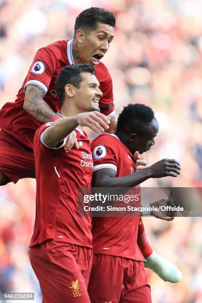 Sadio Mane of Liverpool celebrates with teammates Roberto Firmino of Liverpool and Dejan Lovren of Liverpool after scoring their 1st goal during the...
