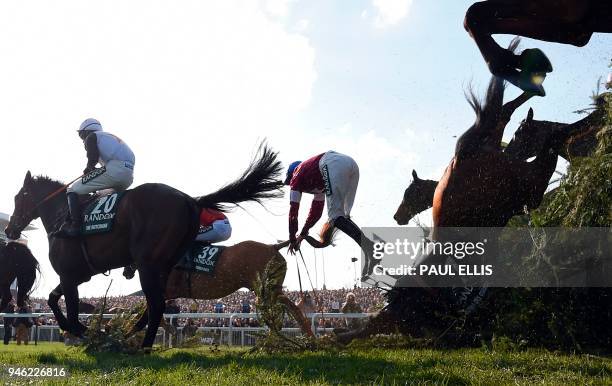 Alpha Des Obeaux unseats jockey Rachael Blackmore at The Chair during the Grand National horse race on the final day of the Grand National Festival...