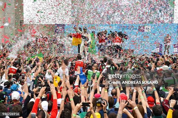 Winner DS Virgin racing team driver Sam Bird of Britain celebrates on the podium after the Rome leg of the Formula E electric car championship in the...