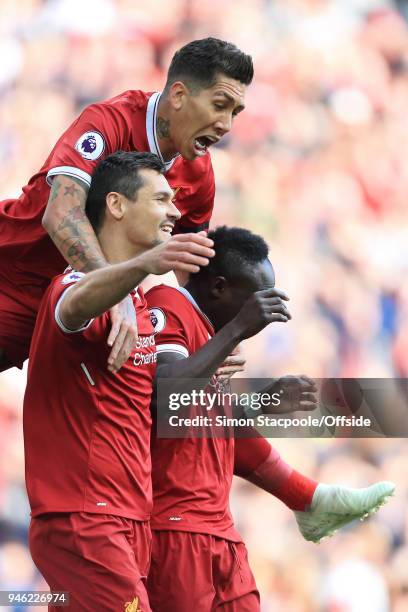 Sadio Mane of Liverpool celebrates with teammates Roberto Firmino of Liverpool and Dejan Lovren of Liverpool after scoring their 1st goal during the...