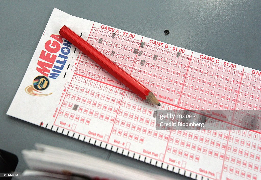 A Mega Millions number selection card lies on the counter at