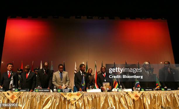 From left to right, Marc Ravalomanana, president of Madagascar, Festus Mogae, president of Botswana, Thomaz Agusto Salomao, executive secretary of...