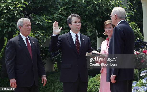 President George W. Bush, left, watches Brett Kavanaugh being sworn in to be a judge on the U.S. Court of Appeals by Supreme Court Justice Anthony M....