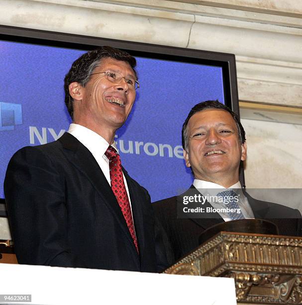 John Thain, chief executive officer of NYSE Euronext, left, accompanies Jose Manuel Barroso, president of the European Commission, during the closing...