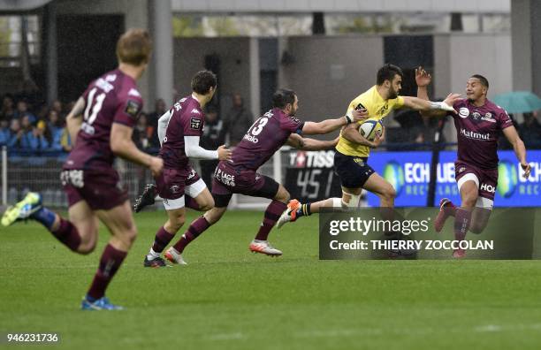 Clermont's Argentinian fly-half Patricio Fernandez runs with the ball during the French Top 14 rugby union match between Clermont and Bordeaux-Begles...