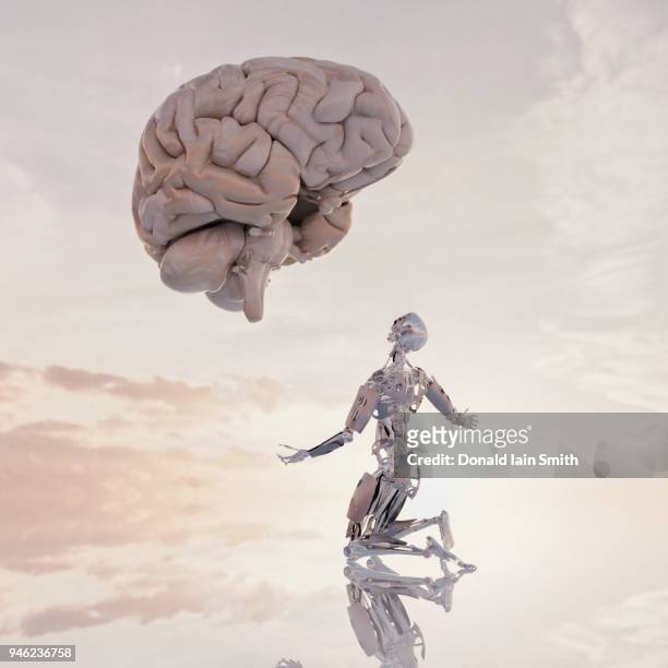 human versus machine: robot supplicates before giant floating human brain - cerebral cortex stock pictures, royalty-free photos & images